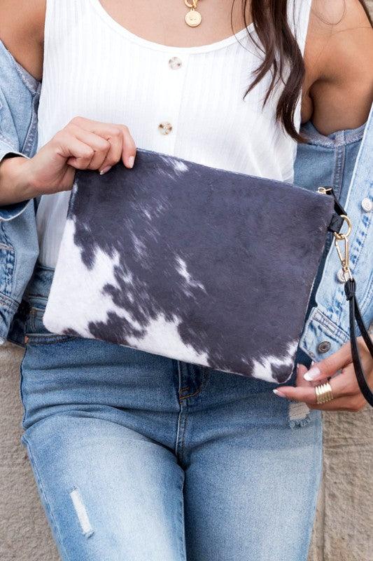 Faux Fur Cow Animal Print Clutch by VYSN